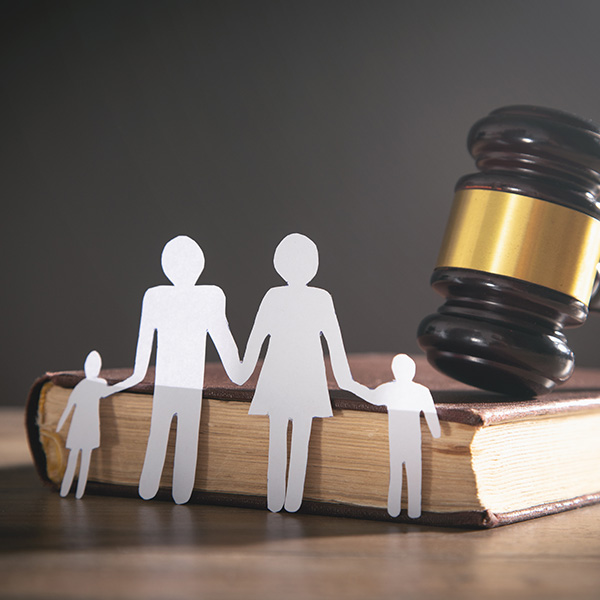 Paper cut family, judge gavel and book